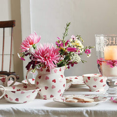Emma Bridgewater Pink Hearts Cereal Bowl, part of the earthenware pink hearts collection. Serve cereal, soup and other delicious dishes in our handcrafted, cream and pink bowls.
